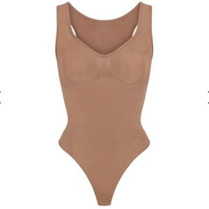 SKIMS Seamless Sculpt Scoop Neck Thong Bodysuit in Sienna